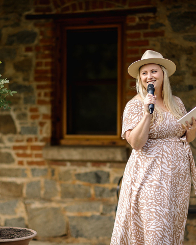 Celebrant talking into microhpone